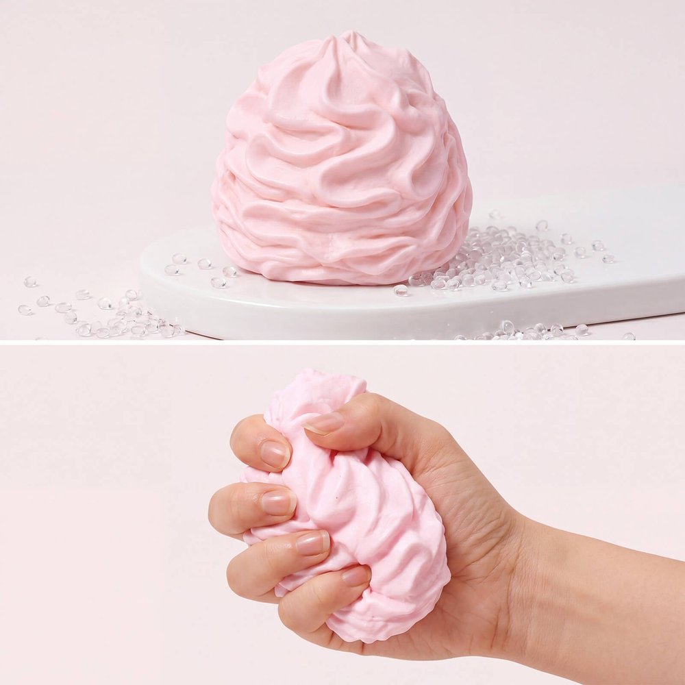 Pink Cream Swirl Squishy Ball being squeezed by Monsclub